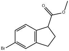 (rac)-5-bromoindan-1-carboxylic acid methyl ester Struktur