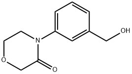 4-[3-(hydroxymethyl)phenyl]morpholin-3-one Struktur